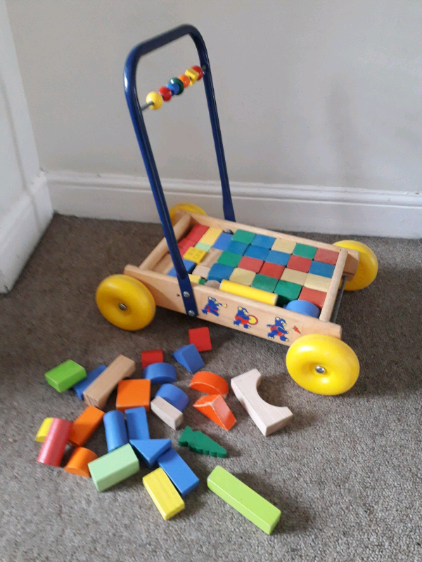 wooden push along trolley with bricks
